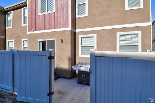 5213 W Courtly Ln, Herriman, UT 84096 - view of property exterior featuring a gate and stucco siding