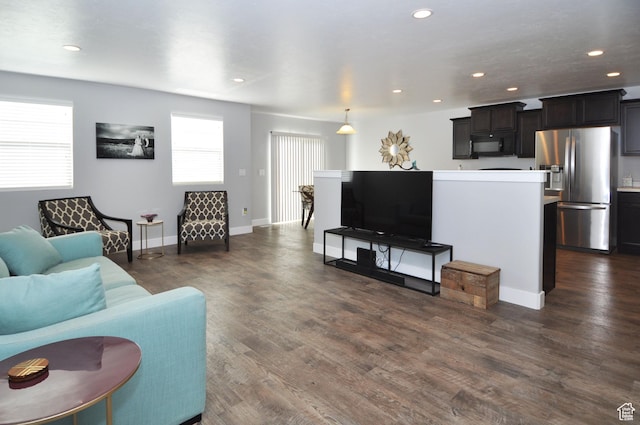 5213 W Courtly Ln, Herriman, UT 84096 - living area featuring dark wood-type flooring, recessed lighting, and baseboards