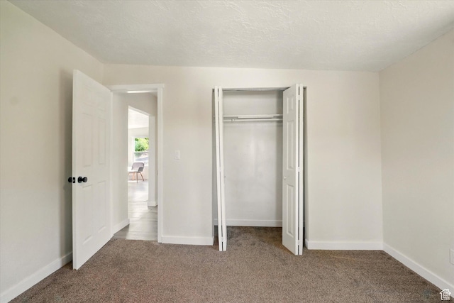 148 E 200 S, Providence, UT 84332 - unfurnished bedroom featuring carpet floors, a closet, and baseboards