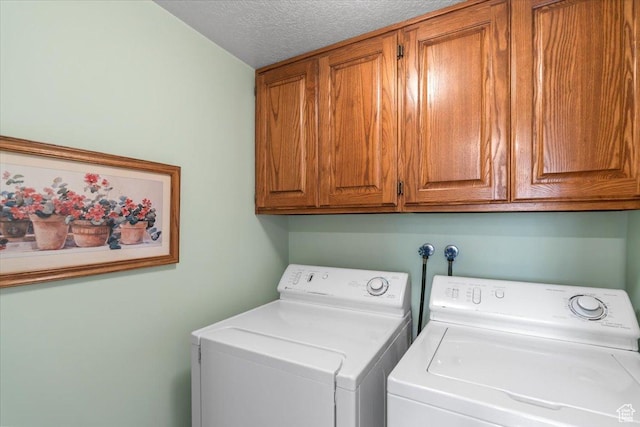 1154 N 700 W, Centerville, UT 84014 - washroom with cabinet space, washing machine and clothes dryer, and a textured ceiling