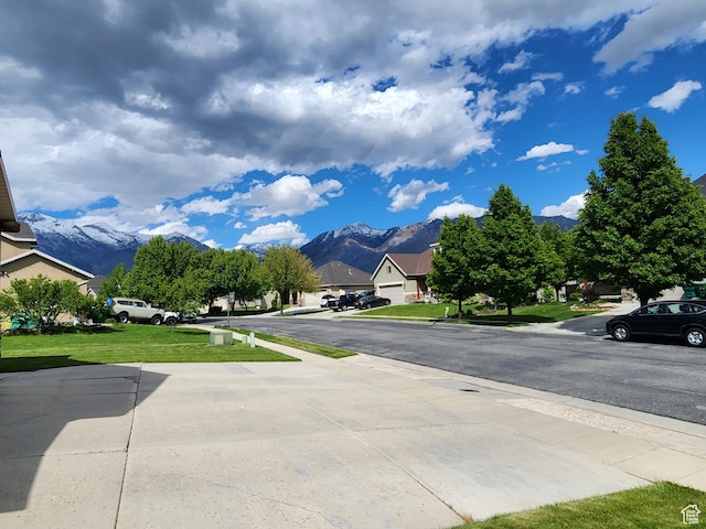 11987 N Cyprus Dr, Highland, UT 84003 - view of road featuring a mountain view, sidewalks, and a residential view