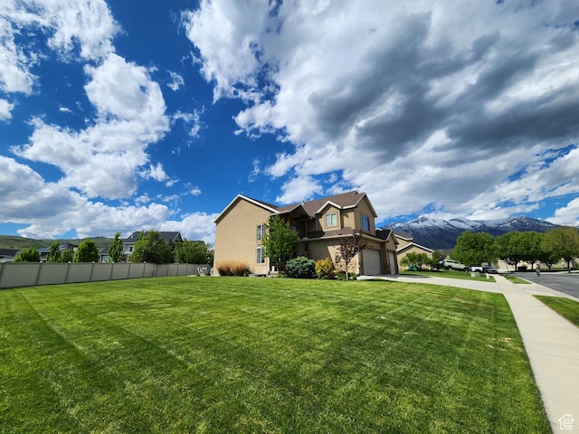 11987 N Cyprus Dr, Highland, UT 84003 - view of front of home featuring concrete driveway, stucco siding, and a mountain view