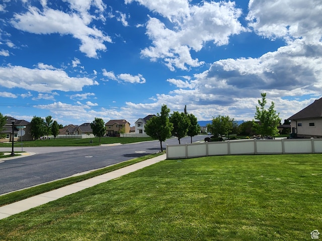 11987 N Cyprus Dr, Highland, UT 84003 - view of asphalt road with a residential view, sidewalks, and curbs