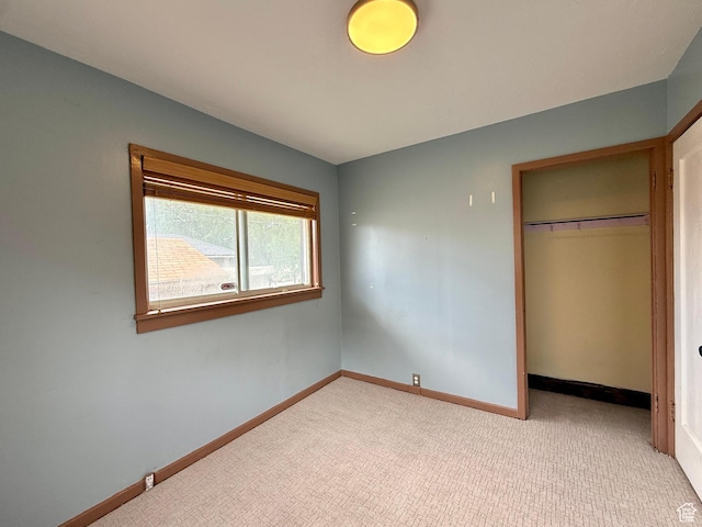 1980 S 600 E, Salt Lake City, UT 84105 - unfurnished bedroom with baseboards, a closet, and light colored carpet