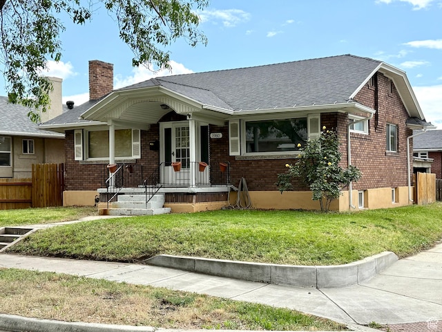 1980 S 600 E, Salt Lake City, UT 84105 - view of front facade with brick siding, a shingled roof, and a chimney