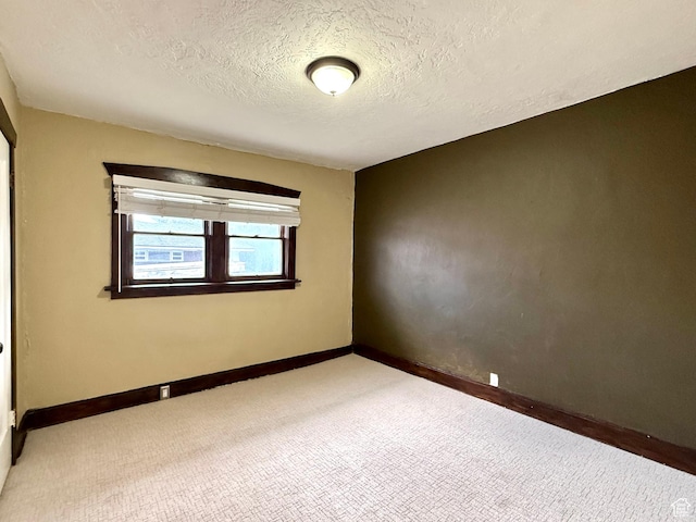 1980 S 600 E, Salt Lake City, UT 84105 - carpeted spare room featuring a textured ceiling and baseboards