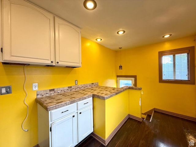 1980 S 600 E, Salt Lake City, UT 84105 - kitchen with white cabinetry, dark wood-type flooring, recessed lighting, light countertops, and a peninsula