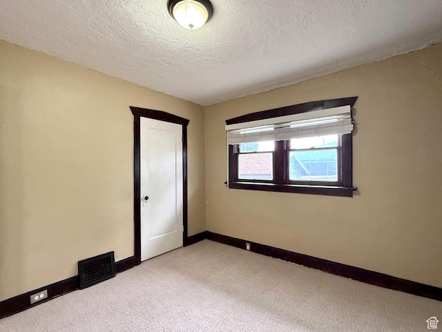 1980 S 600 E, Salt Lake City, UT 84105 - carpeted spare room with baseboards and a textured ceiling