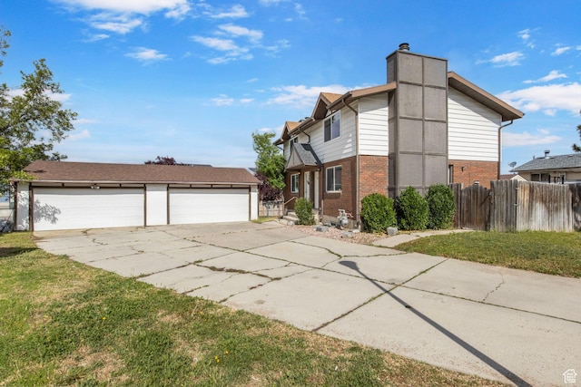 8316 S Carmen Ct E, Sandy, UT 84070 - view of home's exterior featuring brick siding, a detached garage, a chimney, and an outbuilding