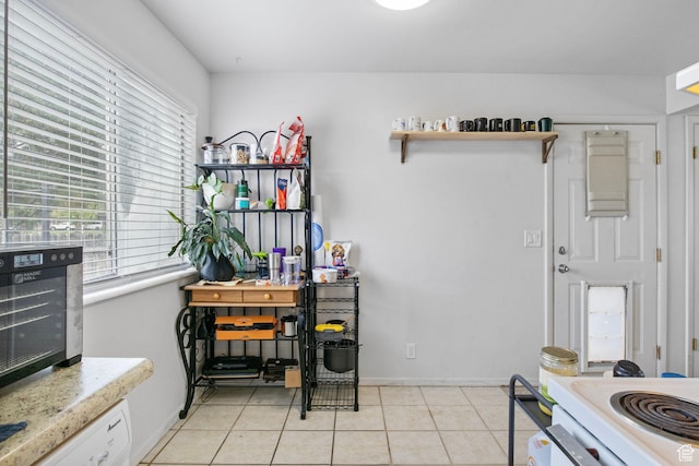 8316 S Carmen Ct E, Sandy, UT 84070 - kitchen with light countertops, plenty of natural light, open shelves, and light tile patterned floors