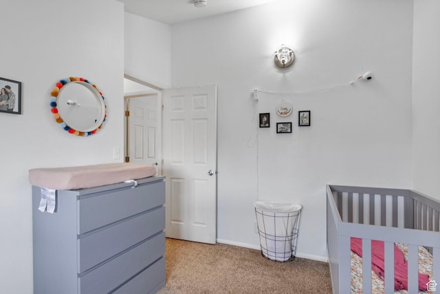 8316 S Carmen Ct E, Sandy, UT 84070 - bedroom featuring light colored carpet, a nursery area, and baseboards