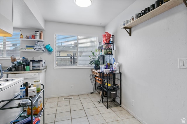 8316 S Carmen Ct E, Sandy, UT 84070 - kitchen with open shelves, baseboards, and light tile patterned flooring