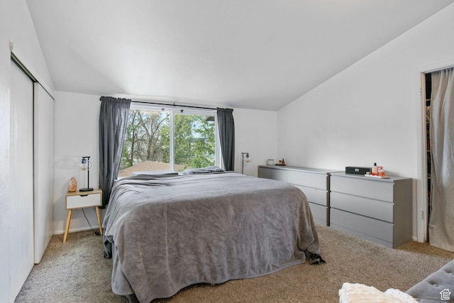 8316 S Carmen Ct E, Sandy, UT 84070 - bedroom featuring vaulted ceiling, light colored carpet, and a closet