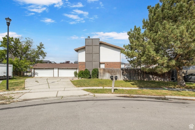 8316 S Carmen Ct E, Sandy, UT 84070 - view of front of house featuring brick siding and a detached garage