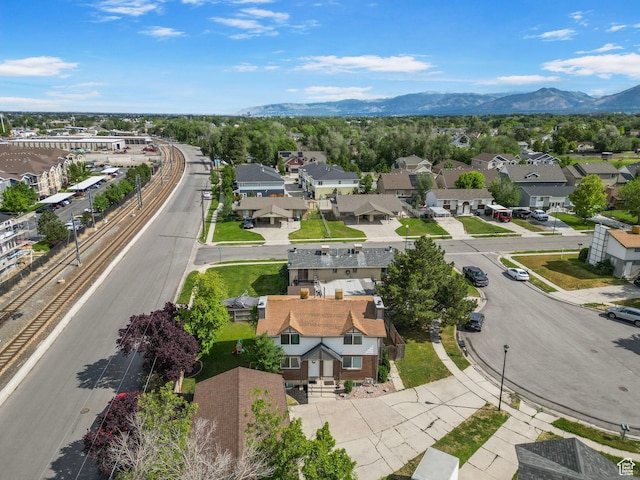 8316 S Carmen Ct E, Sandy, UT 84070 - aerial view of residential area featuring a mountainous background