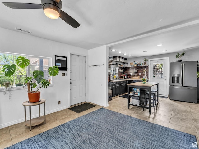7409 S Main St W, Midvale, UT 84047 - foyer entrance featuring bar, a ceiling fan, light tile patterned flooring, recessed lighting, and baseboards