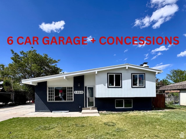 4868 W Seneca Rd S, West Valley City, UT 84120 - view of front of home with a front yard, brick siding, and entry steps