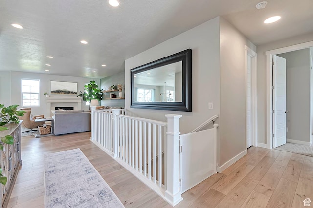 3864 W Safflower Dr, Lehi, UT 84043 - hallway with wood-type flooring, an upstairs landing, recessed lighting, and baseboards