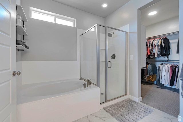 3864 W Safflower Dr, Lehi, UT 84043 - bathroom with a spacious closet, a stall shower, a bath, marble look tiles, and recessed lighting