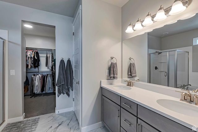 3864 W Safflower Dr, Lehi, UT 84043 - full bathroom featuring marble look tiles, a stall shower, baseboards, double vanity, and a walk in closet
