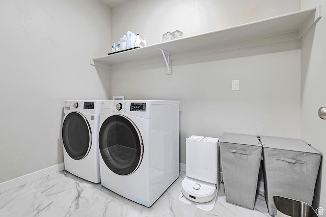 3864 W Safflower Dr, Lehi, UT 84043 - laundry area featuring washing machine and dryer, light marble finish floors, and baseboards