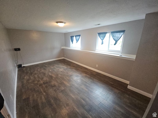 417 W 225 N, Clearfield, UT 84015 - spare room with dark wood finished floors, baseboards, and a textured ceiling
