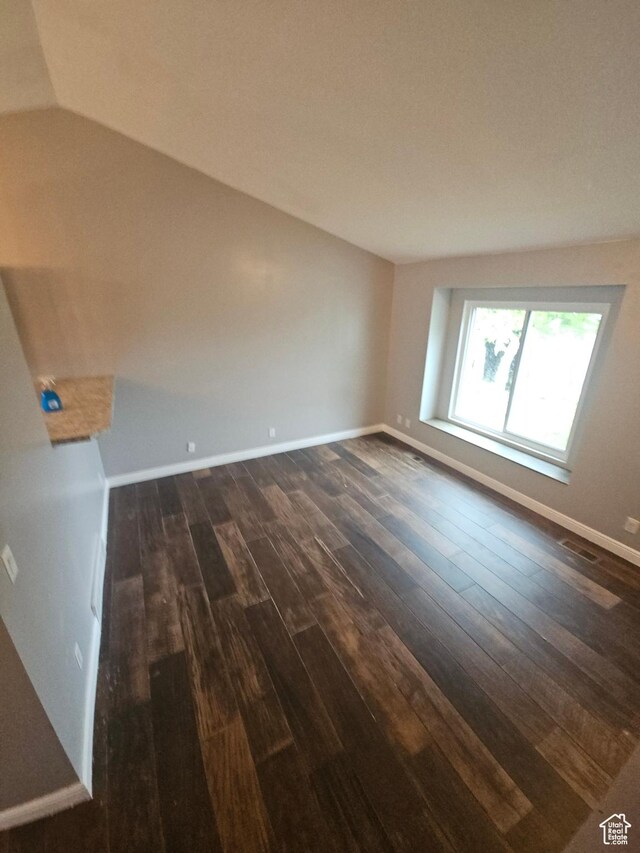 417 W 225 N, Clearfield, UT 84015 - unfurnished room with dark wood-type flooring, baseboards, and vaulted ceiling