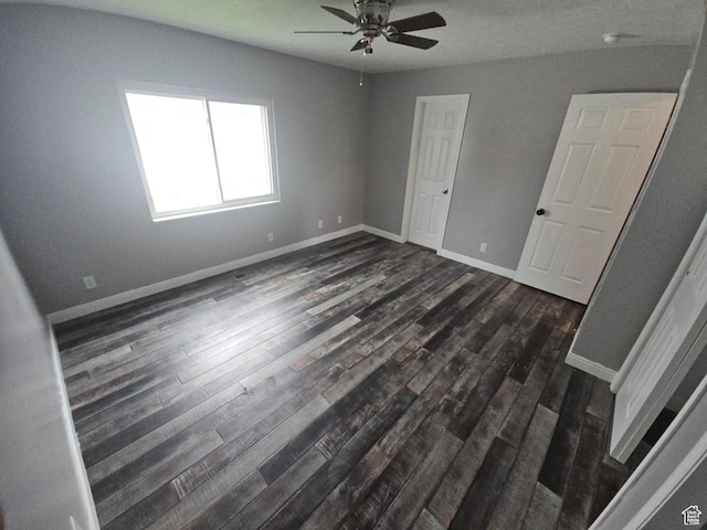 417 W 225 N, Clearfield, UT 84015 - unfurnished bedroom with dark wood-style floors, baseboards, and a ceiling fan