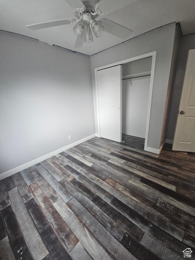 417 W 225 N, Clearfield, UT 84015 - unfurnished bedroom featuring dark wood-type flooring, baseboards, a closet, and a ceiling fan