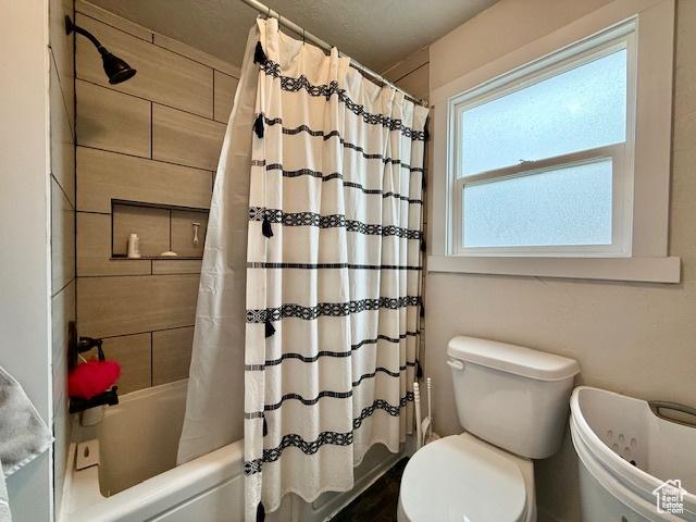 64 S 300 E, Preston, ID 83263 - bathroom featuring toilet and shower / tub combo with curtain
