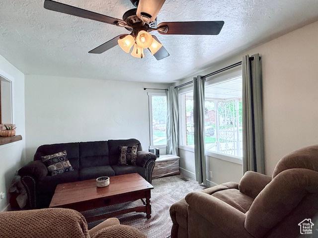 64 S 300 E, Preston, ID 83263 - living area with a textured ceiling, light carpet, and a ceiling fan