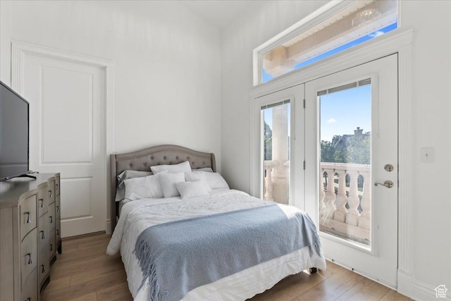 14771 S Brewster Dr, Draper, UT 84020 - bedroom featuring access to exterior and light wood-type flooring
