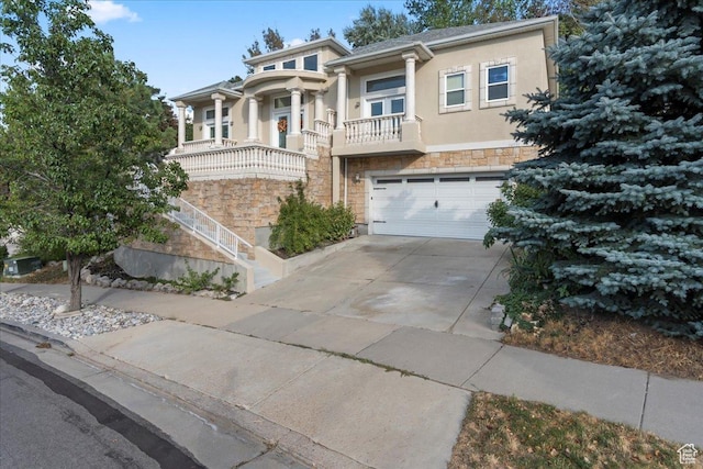 14771 S Brewster Dr, Draper, UT 84020 - view of front facade featuring stone siding, stucco siding, driveway, and a garage
