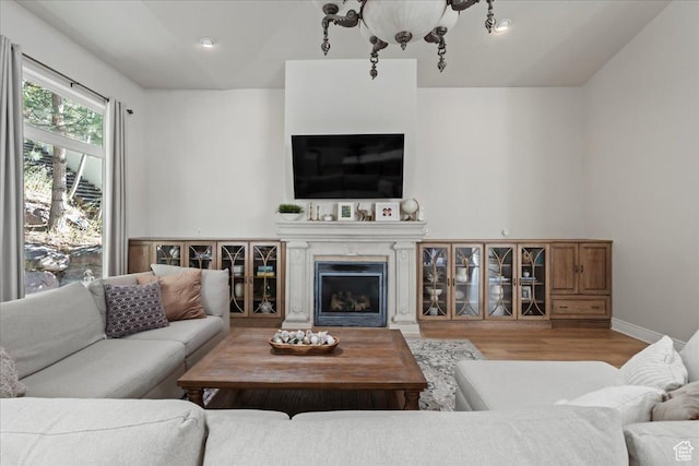 14771 S Brewster Dr, Draper, UT 84020 - living area featuring wood finished floors, a fireplace, and baseboards