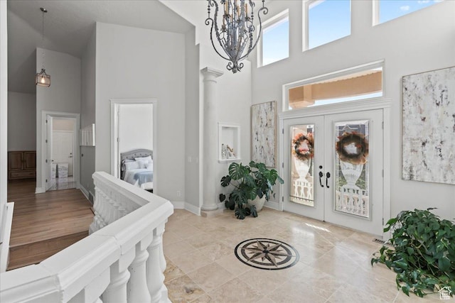 14771 S Brewster Dr, Draper, UT 84020 - foyer entrance with a high ceiling, french doors, a chandelier, and baseboards