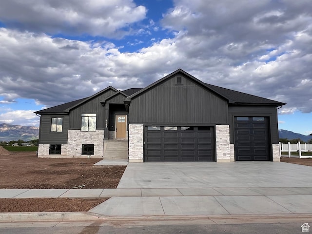 1234 N 4925 W, Plain City, UT 84404 - modern inspired farmhouse featuring a garage, concrete driveway, and stone siding