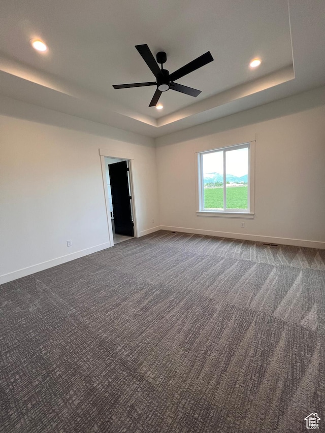 1234 N 4925 W, Plain City, UT 84404 - empty room with a raised ceiling, dark carpet, baseboards, recessed lighting, and ceiling fan
