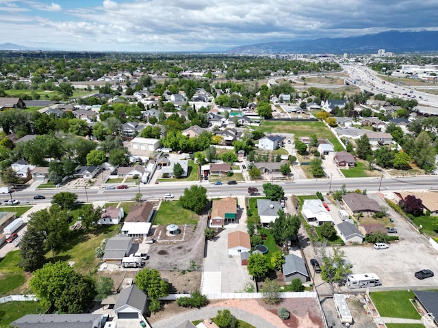 595 W Winchester St, Murray, UT 84123 - aerial view of property's location with nearby suburban area and a mountainous background