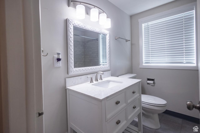 595 W Winchester St, Murray, UT 84123 - full bath with toilet, vanity, a shower, and tile patterned floors
