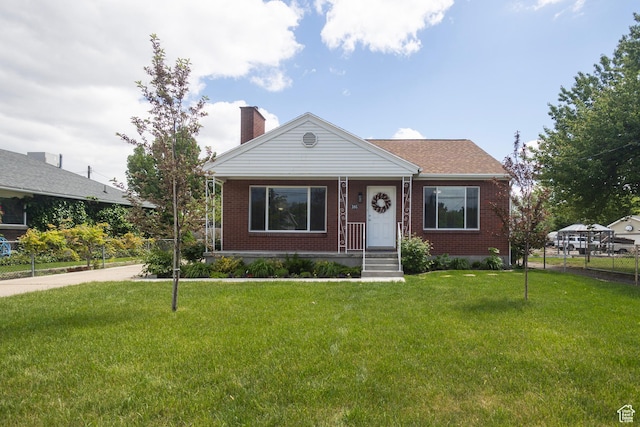 595 W Winchester St, Murray, UT 84123 - view of front facade featuring brick siding and a chimney
