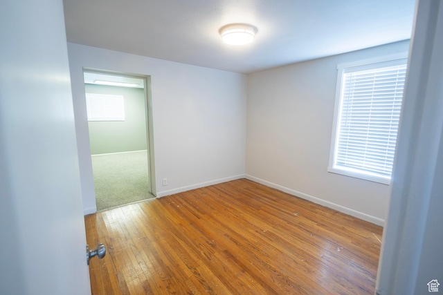595 W Winchester St, Murray, UT 84123 - unfurnished room featuring hardwood / wood-style flooring and baseboards