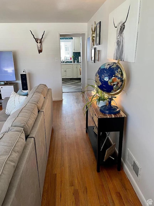 595 W Winchester St, Murray, UT 84123 - living room with dark wood-style flooring and baseboards