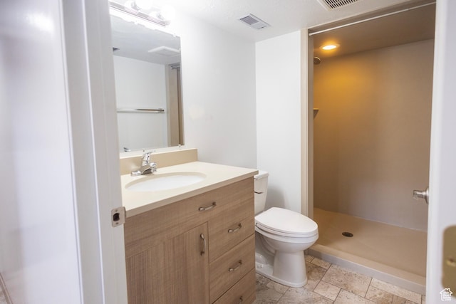 595 W Winchester St, Murray, UT 84123 - full bath with toilet, a stall shower, vanity, and stone tile floors