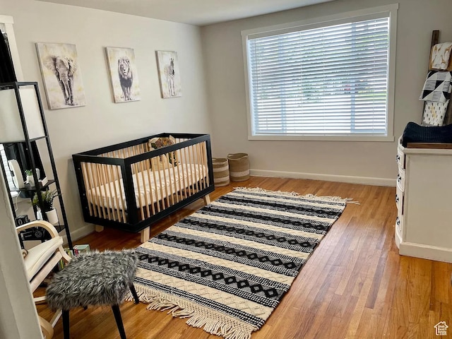 595 W Winchester St, Murray, UT 84123 - bedroom featuring wood finished floors and baseboards