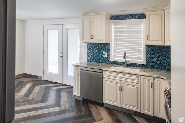 595 W Winchester St, Murray, UT 84123 - kitchen featuring stainless steel dishwasher, a sink, cream cabinetry, french doors, and decorative backsplash