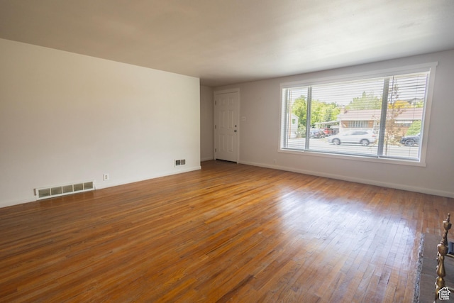 595 W Winchester St, Murray, UT 84123 - unfurnished room featuring hardwood / wood-style flooring and baseboards
