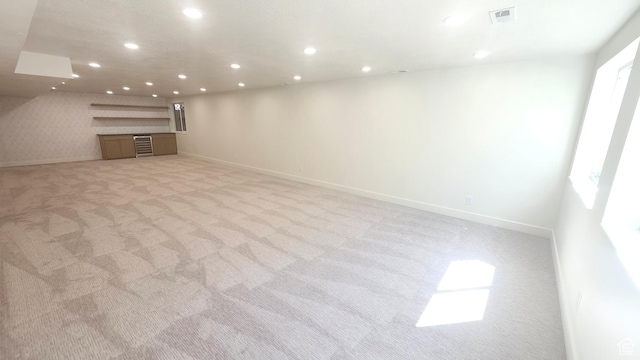 5757 S Surreyrun Rd, Murray, UT 84107 - unfurnished living room with light carpet, baseboards, and recessed lighting