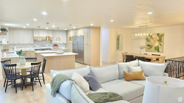 5757 S Surreyrun Rd, Murray, UT 84107 - living room featuring recessed lighting, light wood-type flooring, and baseboards