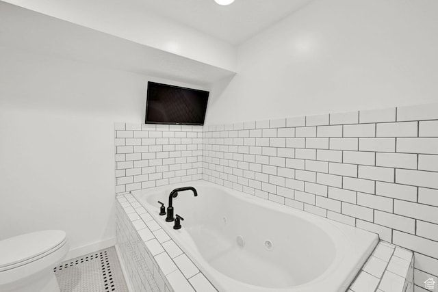 2890 Wheelock Ave, Ogden, UT 84403 - full bathroom with tile patterned floors, a tub with jets, toilet, and baseboards