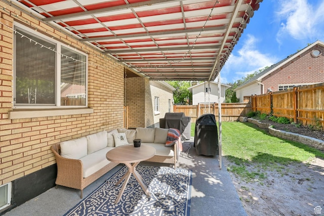 2890 Wheelock Ave, Ogden, UT 84403 - fenced backyard with an outdoor living space, a grill, and a patio area